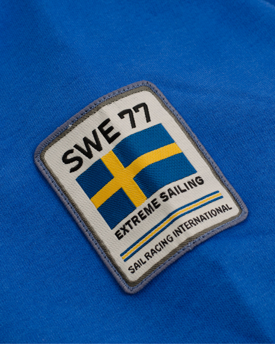 Herr | Tröjor | Sail Racing | International Zip Hood Sweden Punk Royal