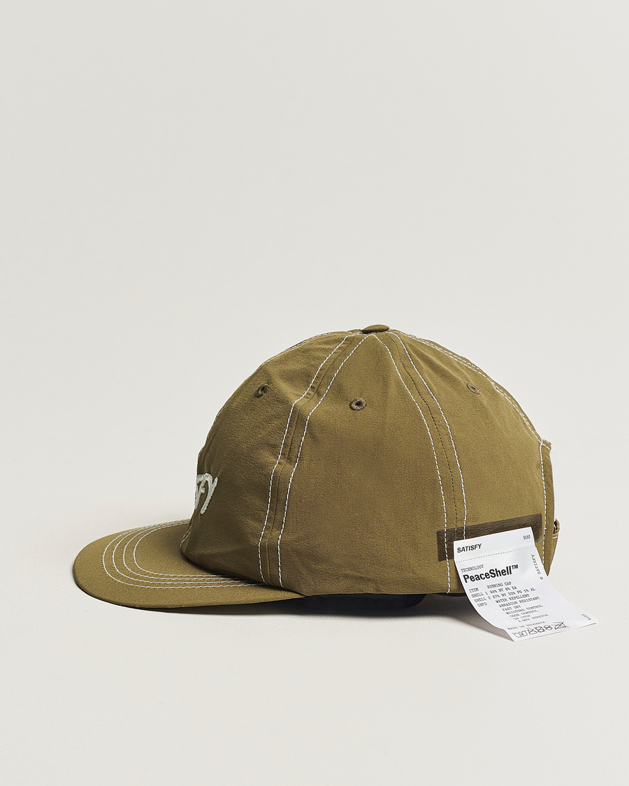 Herr | Avdelningar | Satisfy | PeaceShell Running Cap Oil Green