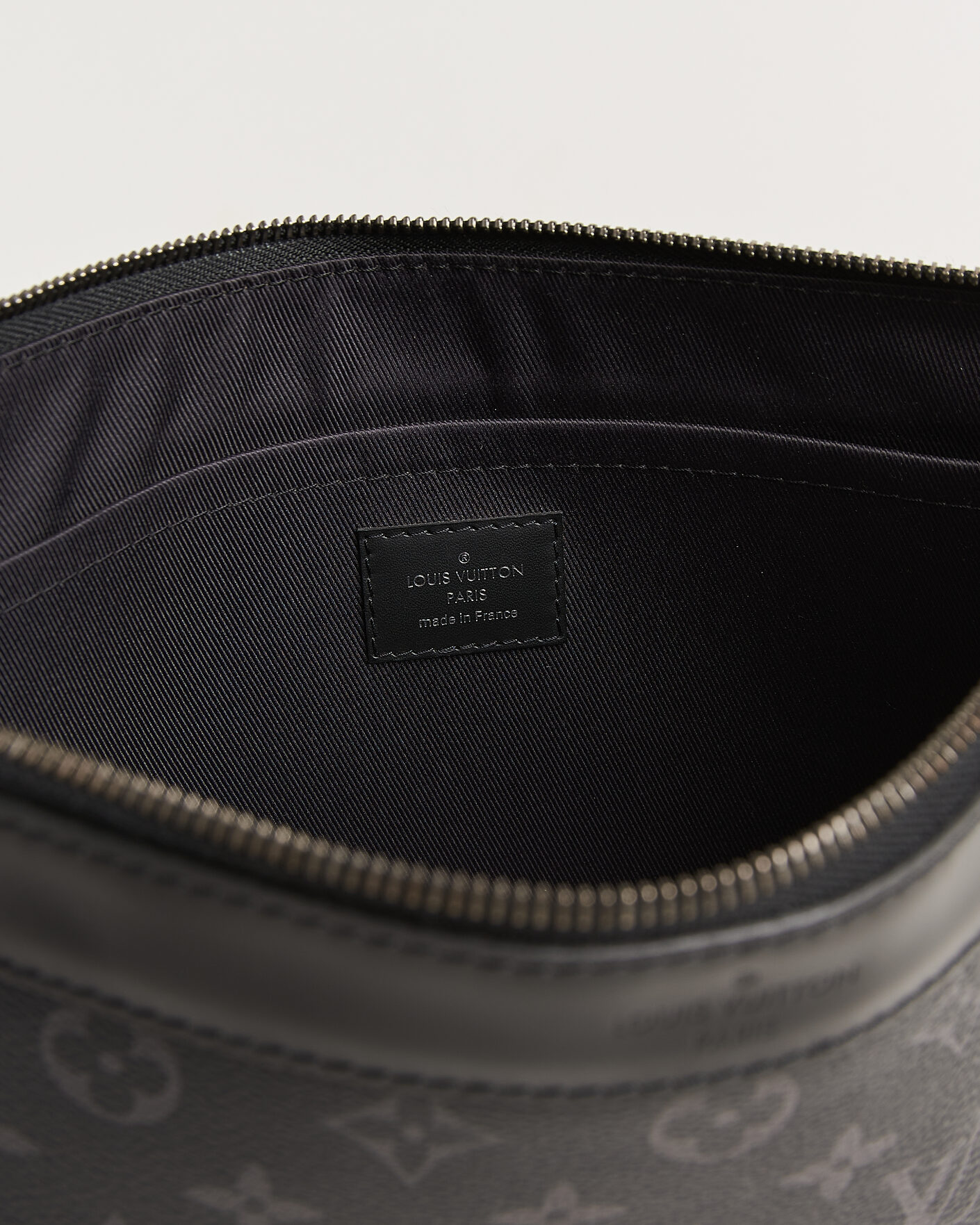 Herr | Pre-Owned & Vintage Bags | Louis Vuitton Pre-Owned | Discovery Pochette Monogram Eclipse